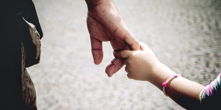 Hands: dad and daughter